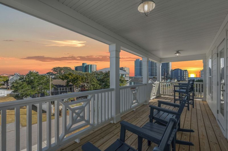 Covered porch overlooking a sunset
