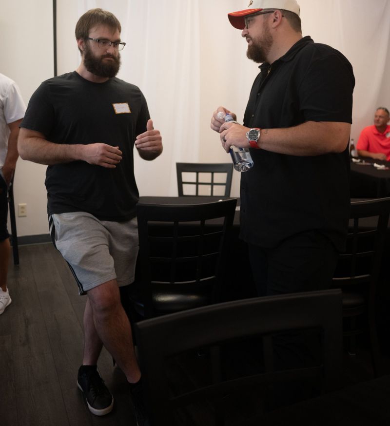 Luke Nesler networking with an investor