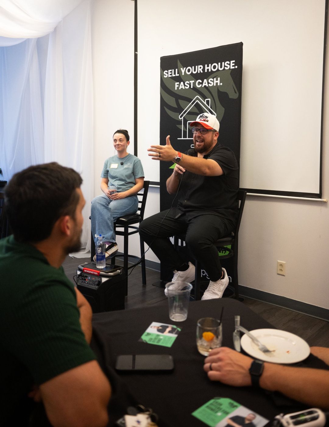 Luke Nesler speaking to a room of investors at a Lucas Property Group event